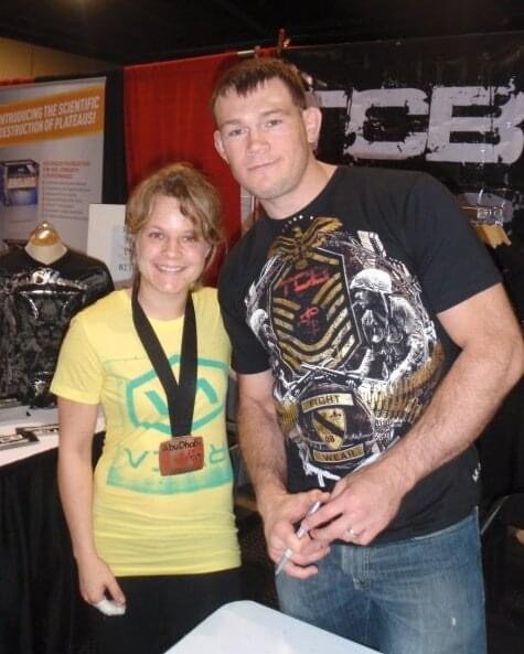 Christine with a medal round her neck beside UFC fighter Forrest Griffin at the Abu Dhabi Pro BJJ championships