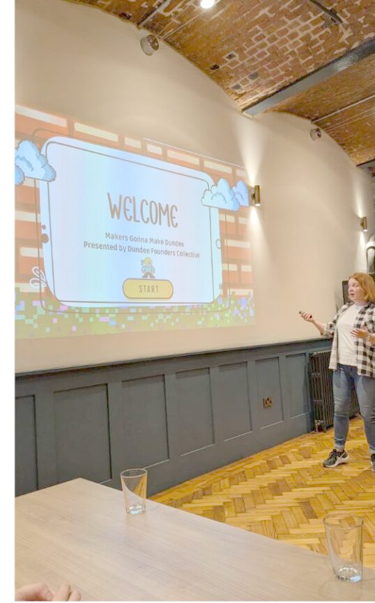 Christine presenting the welcome slide at a Makers Gonna Make Dundee event